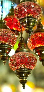 Ornate hanging lanterns with vibrant red glass detail.