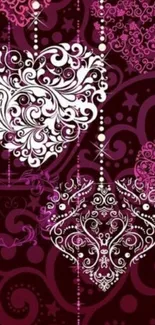 Ornate heart-themed mobile wallpaper in pink and maroon hues.