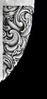 Black and white wallpaper with ornate moon design.