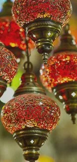 Ornate red lanterns with vintage brass design, perfect for mobile wallpaper.