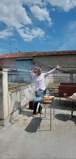 Joyful man cooking at barbecue with blue skies.