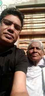 Elderly woman and man in sunlit outdoor portrait.