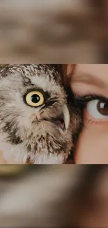 Close-up of an owl and a human eye in an artistic mobile wallpaper.