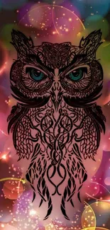 Intricate owl design on fantasy-themed wallpaper with vibrant colors.