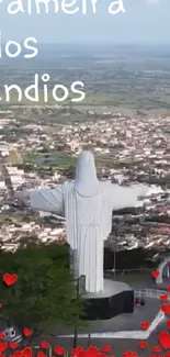 Skyline of Palmeira dos Índios with a statue and heart decorations.