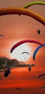 Colorful paragliders soar across a vibrant sunset sky.