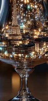 Wine glass reflecting Paris cityscape with iconic landmarks and lights.