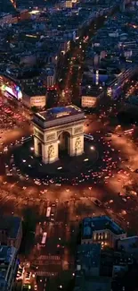 Aerial nighttime view of Paris with illuminated city and landmark.