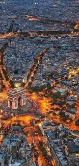 Aerial view of Paris at night with iconic landmarks illuminated.