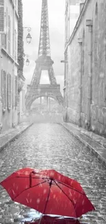 Red umbrella on Paris street with Eiffel Tower.