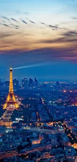 Paris skyline at dusk with Eiffel Tower and illuminated city.