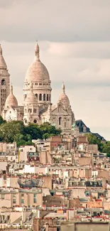 Paris skyline with Sacré-Cœur cathedral in pastel tones.