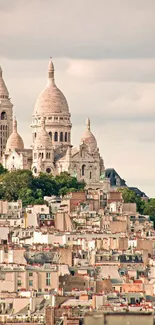 Sacré-Cœur Basilica overlooking Paris cityscape.