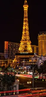 Eiffel Tower replica at night in Las Vegas glow.