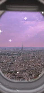 View of Paris and Eiffel Tower through airplane window with purple sky.