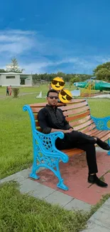 Man sits on ornate blue bench in park under clear sky.