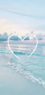 Heart outlined over pastel beach with soft ocean waves.