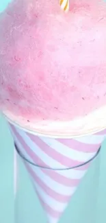 Pastel cotton candy on a cone with a blue background.