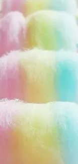 Pastel rainbow cotton candy sticks in soft hues.