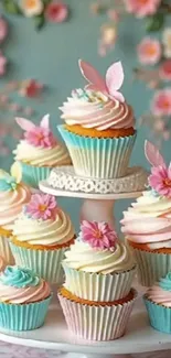 Colorful cupcakes with pastel frosting and floral designs.