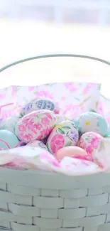 Pastel Easter basket filled with decorated eggs.