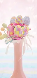 Pastel Easter eggs in a pink vase with heart background.