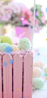 Pastel Easter eggs in a pink basket with heart decorations.