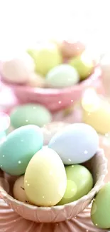 Delicate pastel Easter eggs in elegant pink bowls.