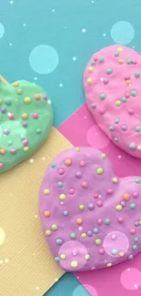 Pastel heart cookies with colorful sprinkles on a vibrant background.