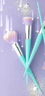 Pastel makeup brushes on a lavender background with glitter accents.