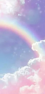 Pastel rainbow over fluffy clouds in a serene sky.