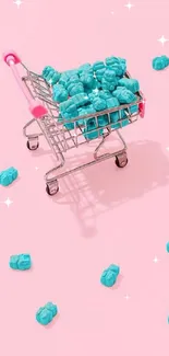 Shopping cart with candy on pastel pink background.