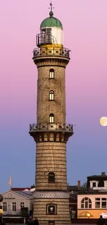 Lighthouse against a pastel sunset sky with moon visible.