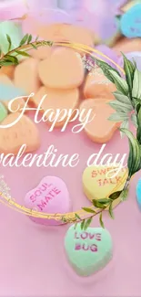 Pastel candy hearts with gold floral wreath for Valentine's Day.