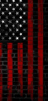 American flag painted on a brick wall with red stripes and white stars.