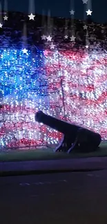 Patriotic American flag light display with cannon silhouette.