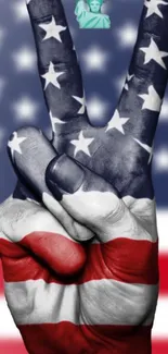 Peace sign hand with American flag design in vivid colors.