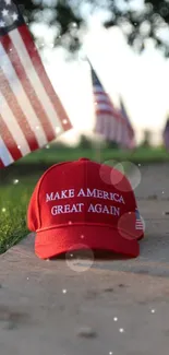 Patriotic wallpaper with red cap and American flags.