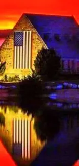 American flag reflecting in a lake at sunset.