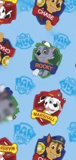 Paw Patrol wallpaper with Chase, Rocky, and Marshall on light blue.