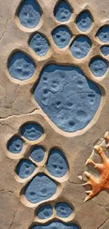 Artistic paw print fossil design wallpaper with beige and blue hues.
