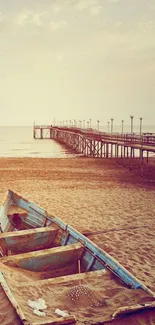 Abandoned boat on a sandy beach by the calm sea at sunrise.