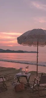 Serene beach setup with pink sunset sky.