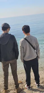 Two friends walking on a tranquil beach