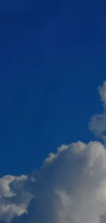 A calming view of a blue sky with fluffy white clouds.