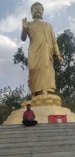 Golden Buddha statue in tranquil scenery.