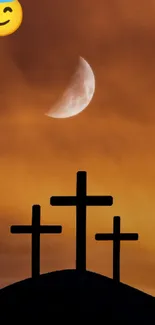 Silhouette of three crosses at sunset with a serene sky backdrop.