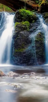 Serene forest waterfall mobile wallpaper with cascading water.