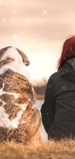 Woman and dog sitting by a serene lakeside at sunset.