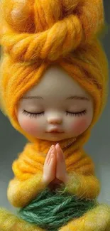 Meditative doll wrapped in yellow yarn in a peaceful pose.